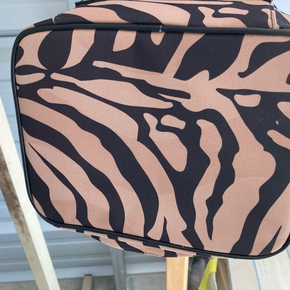 Tiger striped makeup bag. Not brand name but NWT!